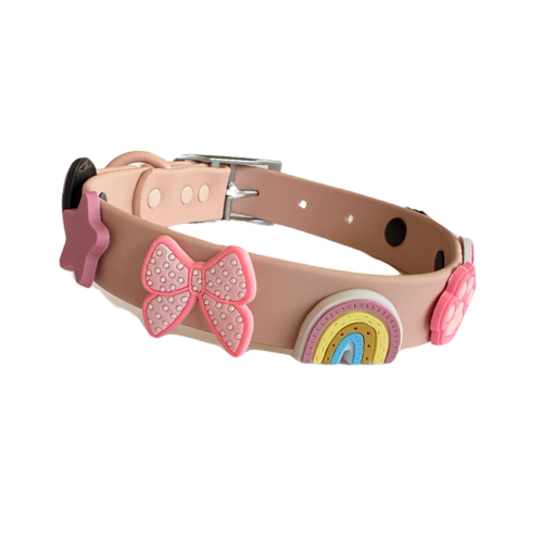 Dog collar with pink bow and rainbow design on a white background