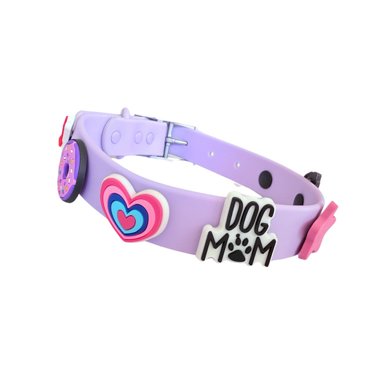 Purple dog collar with heart and paw print decorations on a white background
