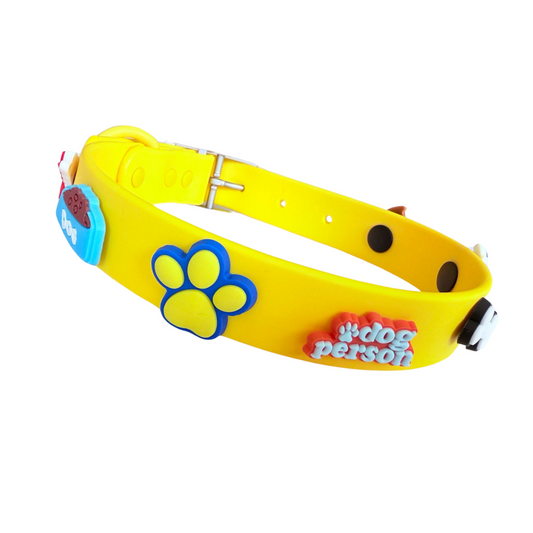 Yellow dog collar with paw print and 'dog person' text on a white background